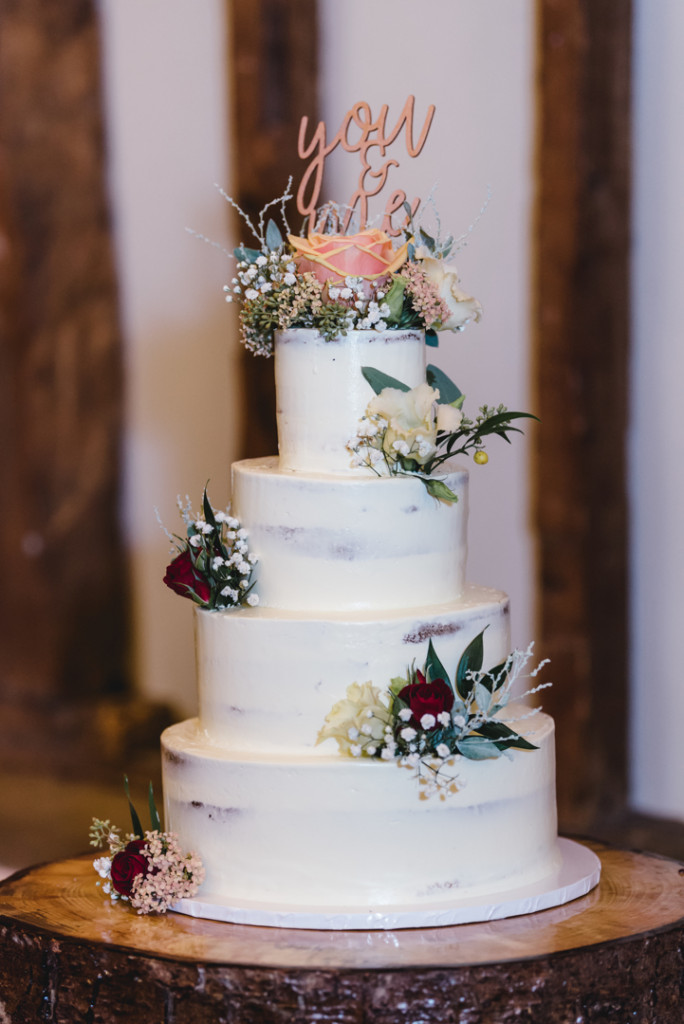 alternative semi-naked wedding cake with fresh flowers