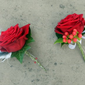 red buttonholes with feather