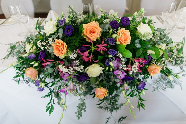 colourful wedding flowers at the sir christopher wren hotel, windsor