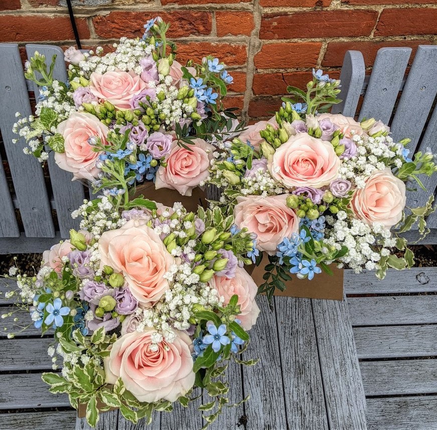 pale pink and blue bridesmaids bouquets